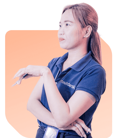 Outdesk Staff Member Mary wearing a blue outdesk polo looking to the right and smiling on an orange background